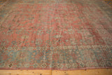 Distressed vintage Mahal rug showcasing worn dusty raspberry floral field and wide powder blue border.
