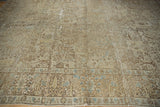 Distressed texture on a vintage Tabriz carpet with a time-softened forest and deer pattern.