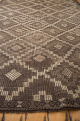 Distressed texture of vintage Turkish Jijim carpet with charcoal and silver geometric guls.