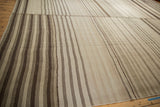 Patchwork Turkish Kilim carpet with varied horizontal striations in chocolate brown, greige, ivory.