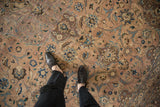 Distressed Kashan rug pile detail with scrolling islimis in dusty mauve, peach, and blue.