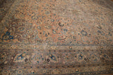 Distressed Persian Kashan carpet border with curvilinear dusty mauve, blue, brown patterns.