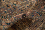 Distressed vintage Kashan rug fold; worn pile, scrolling islimis, and indigo, peach, brown tones.