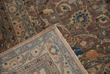 Vintage Distressed Kashan carpet detail: worn scrolling islimis, blues, browns, and multi-tiered border.