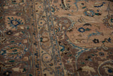 Distressed Kashan carpet features scrolling floral motifs, even wear, mauve, peach, and blue tones.
