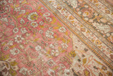 Distressed vintage Doroksh rug: dusty raspberry field, saffron vinery, ivory blossoms, foundation wear, and border details.