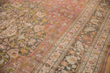 Distressed Doroksh carpet detail, faded vinery, blossoms, dusty raspberry, charcoal, and worn texture.