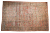 Distressed vintage Mahal carpet with allover floral design in cochineal red and dusty teal.