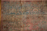 Detail of vintage Distressed Mahal rug pile, revealing time-softened cochineal red and dusty teal tones.
