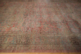Distressed Mahal rug border and field with time-softened dusty rose and teal floral motifs.