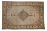 Vintage distressed Tabriz carpet with a diamond Herati medallion on a neutral beige field with red and blue details.