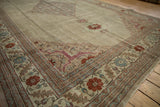 Even wear to the knot heads on the floral border of a vintage Tabriz carpet.