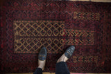 Vintage Belouch rug, central germinating tree of life motif in camel, sand, and red tones.