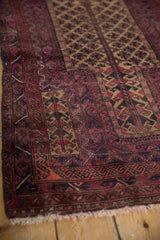 Vintage Persian Belouch rug section displaying germinating tree of life and serpent wave borders.