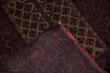 Belouch rug corner displays camel and red pile, hand-knotted foundation, and reddish fringe.