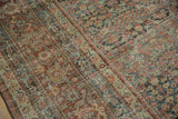 Distressed texture of a vintage Mahal carpet, showing faint foundation and softened motifs.