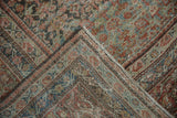 Distressed vintage Mahal carpet pile showing even wear, dusty teal, red henna design.