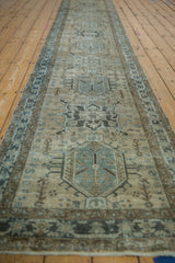 Distressed Karaja rug runner featuring geometric medallions, human effigies, and soft greige blue.