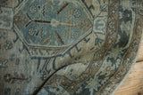 Distressed Karaja rug runner texture with muted slate blue, greige, and bronze geometric designs.