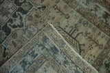 Folded distressed Karaja runner, revealing faded greige, pale coffee, and teal geometric designs.