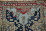 Geometric starburst and pinwheel blossoms detail in navy, sky blue, and cherry red.