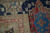 Geometric patterns of a vintage Northwest Persian rug pile with even wear and its woven foundation.