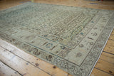 Corner view of a vintage Hamadan rug highlighting the serpent-style border and textural, low pile.