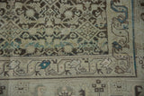 Worn, hand-knotted texture of a vintage Hamadan, detailing the serpent border and Herati field.