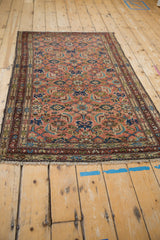 Traditional Hamadan rug corner, showing dusty blush field, Herati pattern, and multi-hued borders.