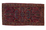 Vintage American Sarouk rug runner with a central medallion and floral sprays on a cherry red field.