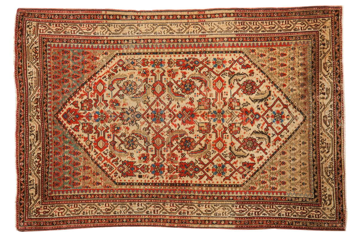 Vintage distressed Persian Serbend rug with an allover Herati design in cream, red, and mallard green.