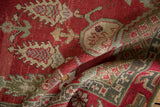 Vintage Oushak rug texture detail: cherry red with olive green and oxidized silver patterns.