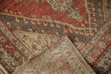 Hand-knotted Oushak rug with distressed pile, showcasing its durable woven back.