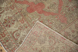Folded corner of a distressed Kayseri rug revealing its hand-knotted construction.