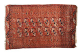 Vintage Persian Belouch rug with double-column geometric guls in madder red, navy blue, and ivory.