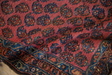 Deep blush field of Vintage Kurdish Hamadan rug, showcasing staggered boteh and sapphire blue border.