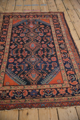 Vintage Malayer rug's Herati pattern, navy and brick red medallions with sapphire blossoms.