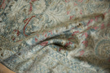 Distressed Lilihan rug pile showcasing lustrous dusty teal and deep blush floral motifs.
