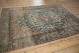 Distressed Hamadan rug with serrated leaf border, dusty teal, and worn field.