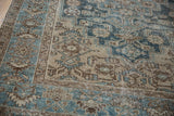 Worn-to-the-knot texture on a vintage Hamadan rug's dusty blue and beige geometric border.