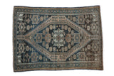 Distressed vintage Malayer rug, oversize serrated medallion on a dusty teal and beige geometric floral field.