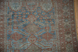 Distressed Belouch runner with sapphire blue and terracotta serrated leaf gul motifs.