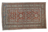 Antique Caucasian Shirvan rug with a distressed perpedil design in shades of chestnut, copper, ivory, and sand.