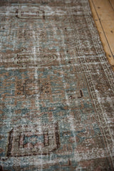 Distressed Persian Hamadan rug showing worn texture, foundation, dusty teal, copper, and ivory tones.