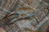 Distressed Hamadan runner texture, showing foundation, dusty teal, and copper brown tones.