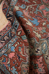 Detailed pile of the vintage Heriz rug, showing even wear and rich Karaja patterns.