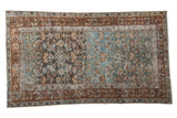 Vintage distressed Malayer rug displaying an allover Herati design with heavy abrashes in powder blue and chestnut.