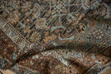 Worn pile and knot heads of a distressed Malayer rug with teal and chestnut Herati motifs.