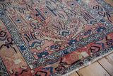 Distressed rose field with visible foundation showing through navy and sky blue motifs.