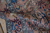 Vintage Distressed Hamadan rug pile with worn rose, blue, and brown floral motifs.